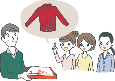 真っ赤なジャケットをプレゼントされている還暦の男性 真っ赤なジャケットをプレゼントされている還暦の男性