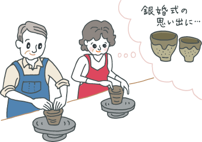 陶芸体験で楽しそうに夫婦湯飲みを作る銀婚式の夫婦 陶芸体験で楽しそうに夫婦湯飲みを作る銀婚式の夫婦