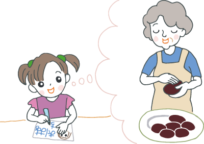 “おはぎを作ってくれるおばあちゃん”を想像しながらメッセージカードを作っている幼い孫 “おはぎを作ってくれるおばあちゃん”を想像しながらメッセージカードを作っている幼い孫